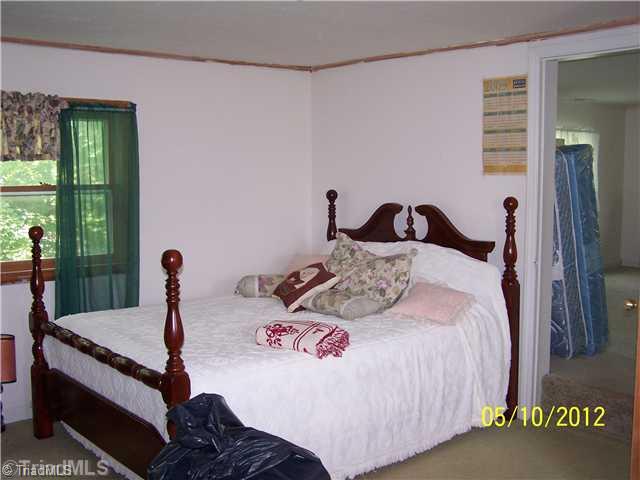 1828 Ray Wilson Road Sandy Ridge, NC 27046 - Photo 13 of 16 1st Bedroom. Upstairs bedroom 1 of 3 or 4