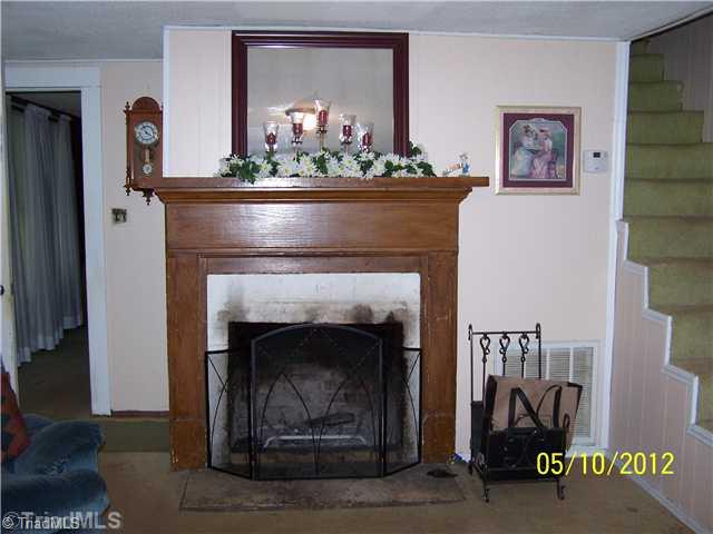 1828 Ray Wilson Road Sandy Ridge, NC 27046 - Photo 9 of 16 Living Room. Living Room Fireplace