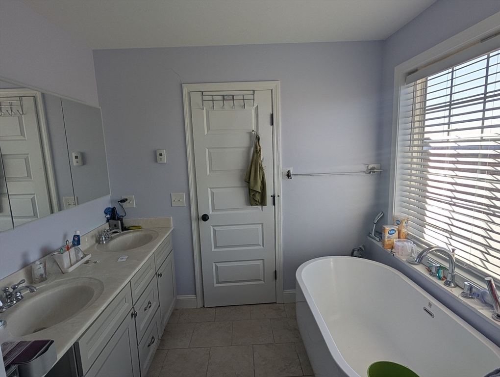 456 Ridge Road Athol, MA 01331 - Photo 18 of 26 a bathroom with a tub sink and mirror