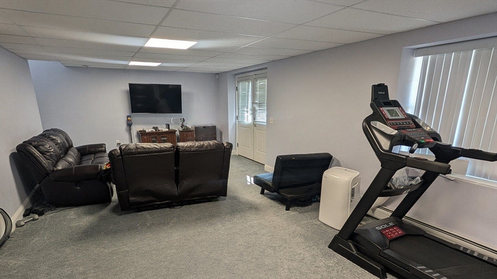 456 Ridge Road Athol, MA 01331 - Photo 24 of 26 a living room with furniture and a flat screen tv