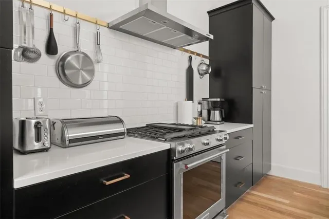 a kitchen with a stove and a sink