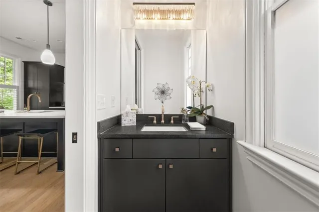 a bathroom with a sink and a mirror