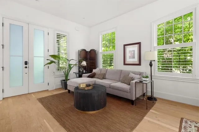 a living room with furniture and a large window