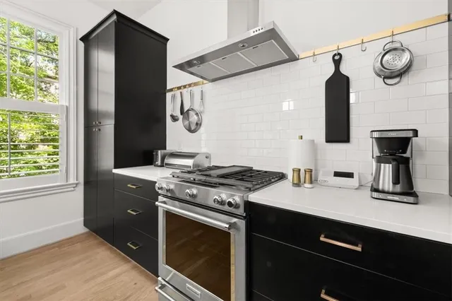 a kitchen with a stove and a refrigerator