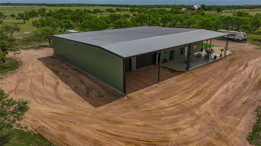 1250 County Road Brady, TX 76825 - Photo 34 of 40 a aerial view of a house with a yard