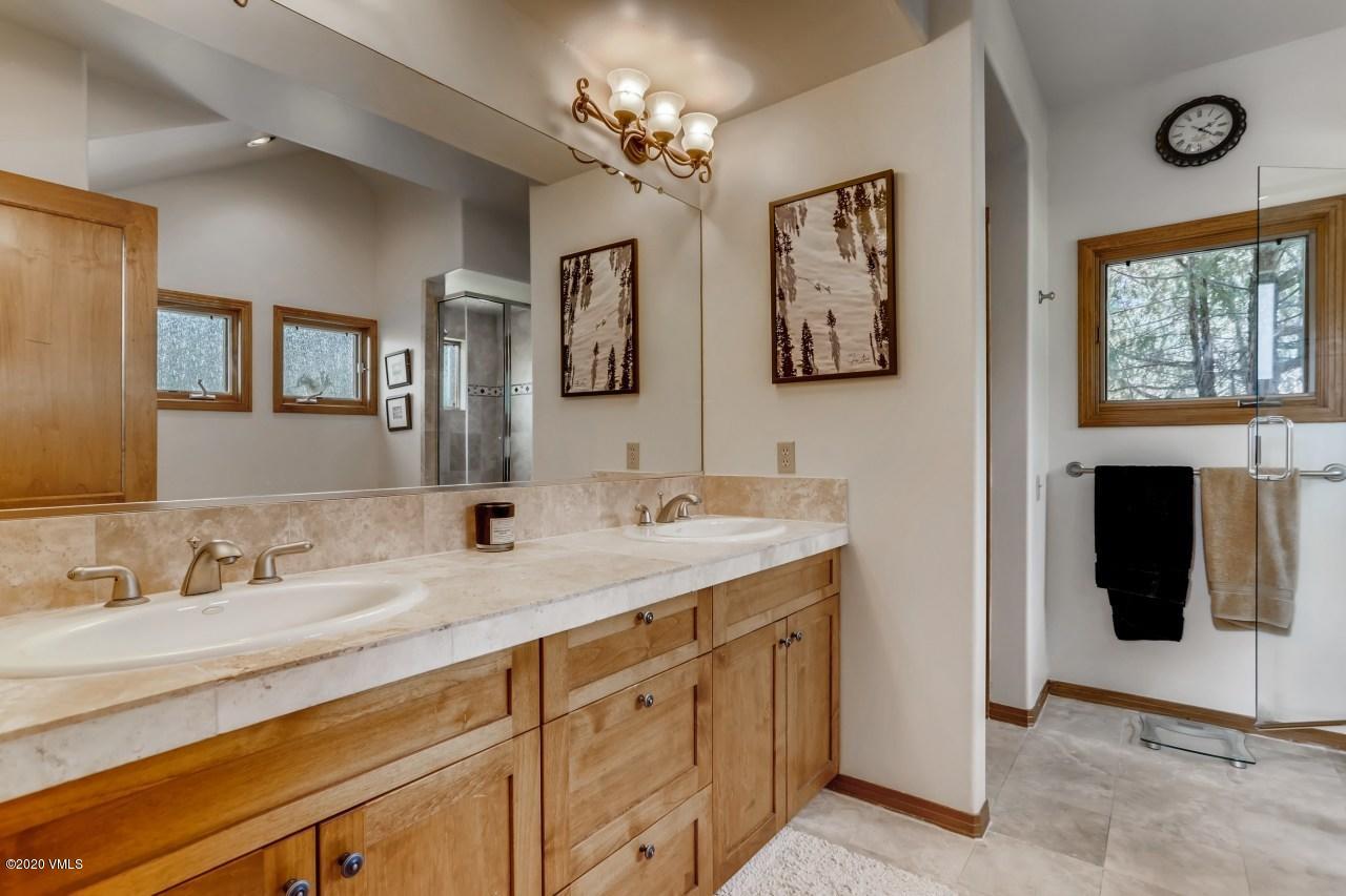 145 Hereford Road Edwards, CO 81632 - Photo 16 of 24 a bathroom with double sink and a mirror