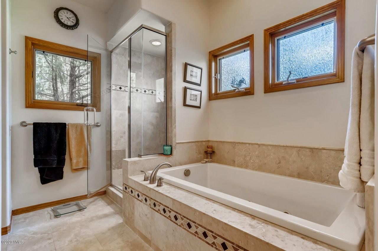 145 Hereford Road Edwards, CO 81632 - Photo 17 of 24 a bathroom with a bathtub and a shower