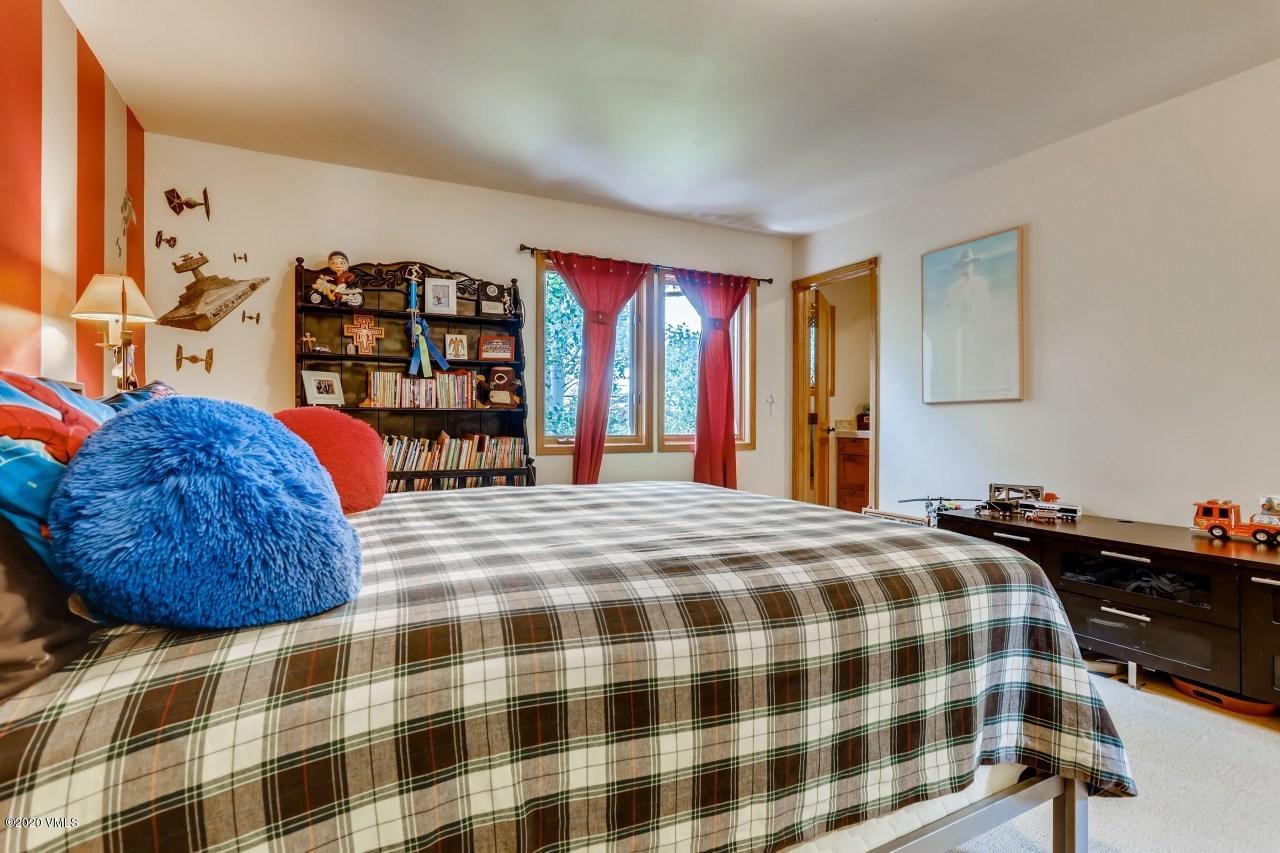 145 Hereford Road Edwards, CO 81632 - Photo 18 of 24 a bedroom with a bed and dresser