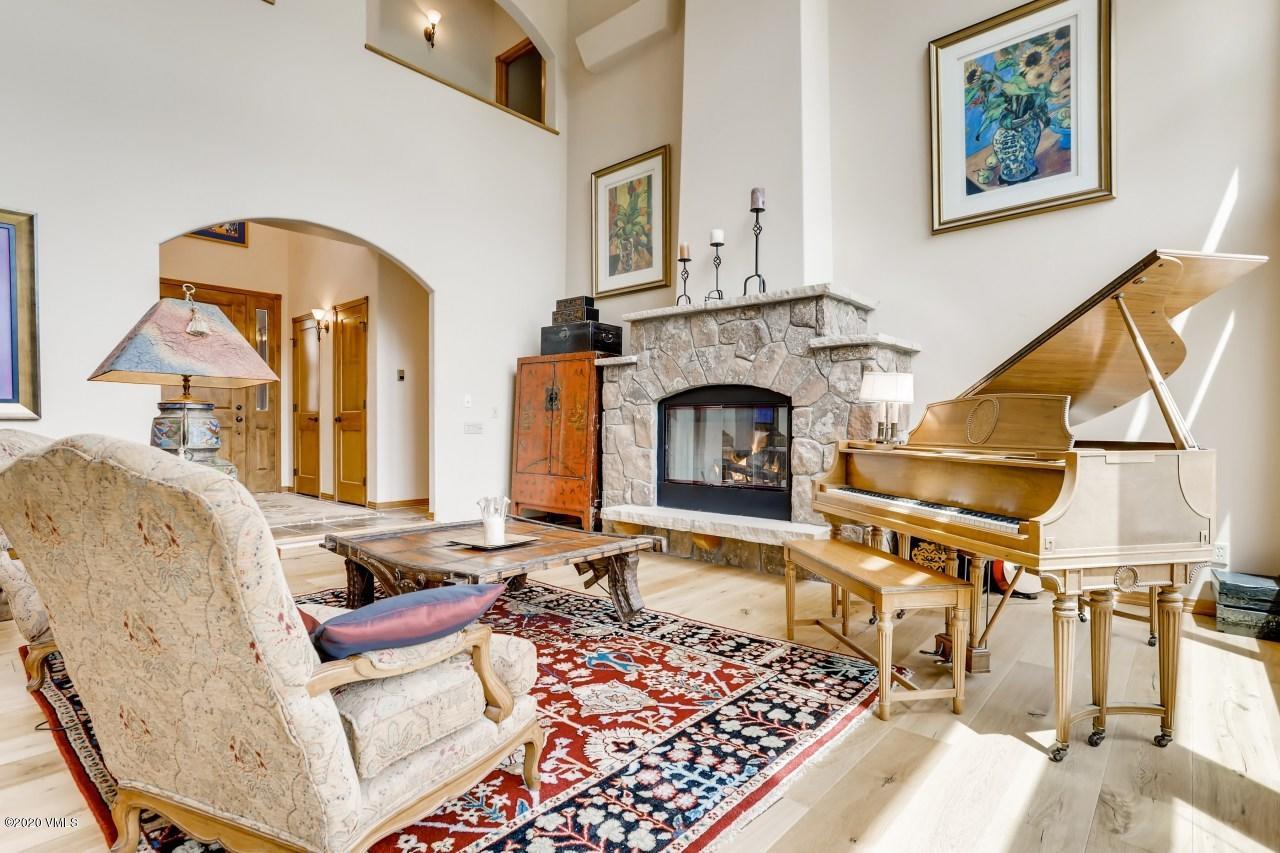 145 Hereford Road Edwards, CO 81632 - Photo 4 of 24 a living room with furniture a fireplace and a table