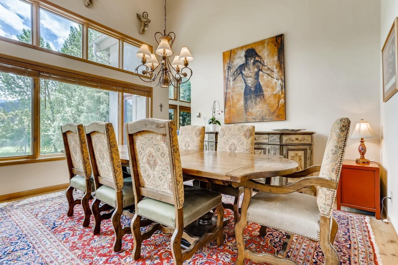 145 Hereford Road Edwards, CO 81632 - Photo 6 of 24 a view of a dining room with furniture window and wooden floor
