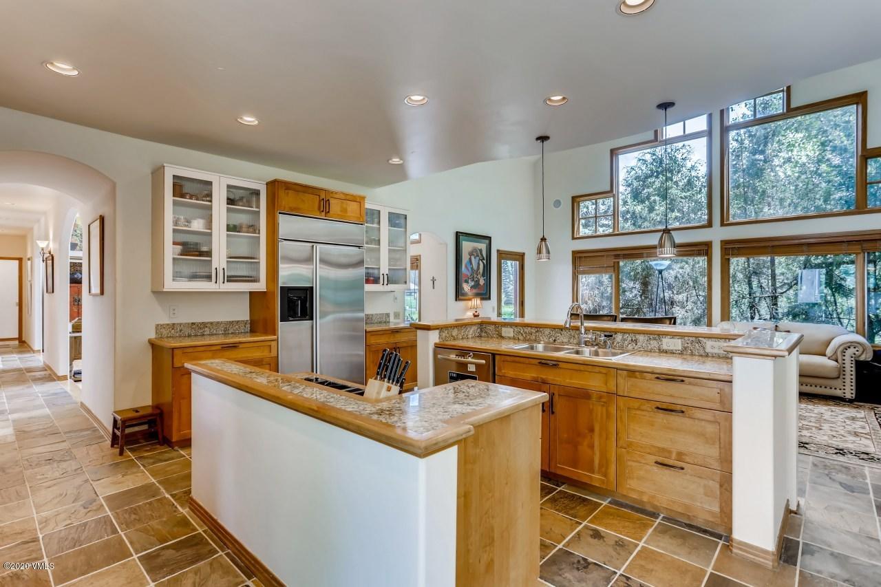 145 Hereford Road Edwards, CO 81632 - Photo 7 of 24 a kitchen that has a sink and a stove in it