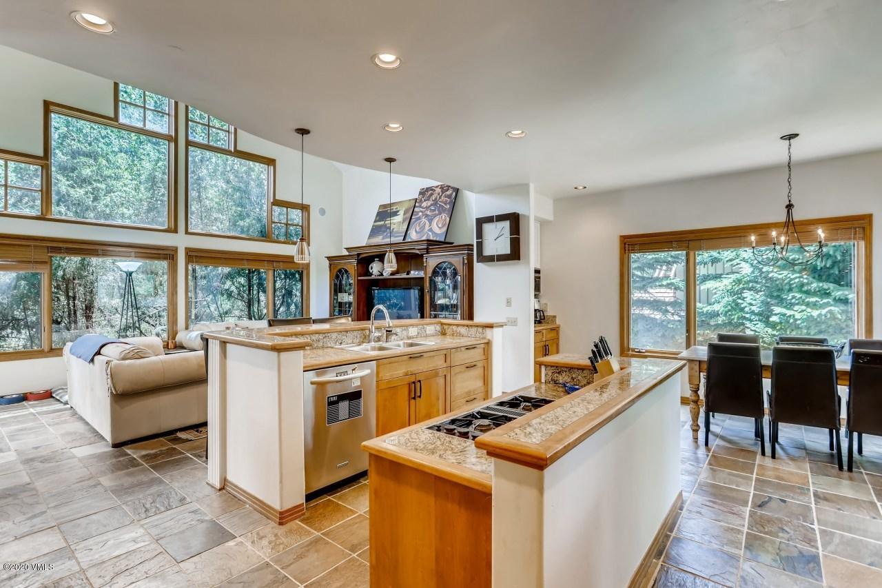 145 Hereford Road Edwards, CO 81632 - Photo 8 of 24 a kitchen with stainless steel appliances granite countertop a stove and a refrigerator