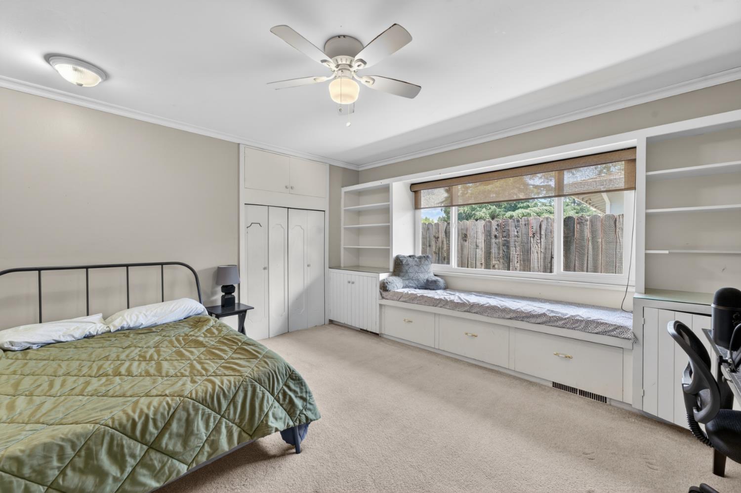 1880 Magnolia Street Gridley, CA 95948 - Photo 31 of 95 a spacious bedroom with a large bed and a chandelier