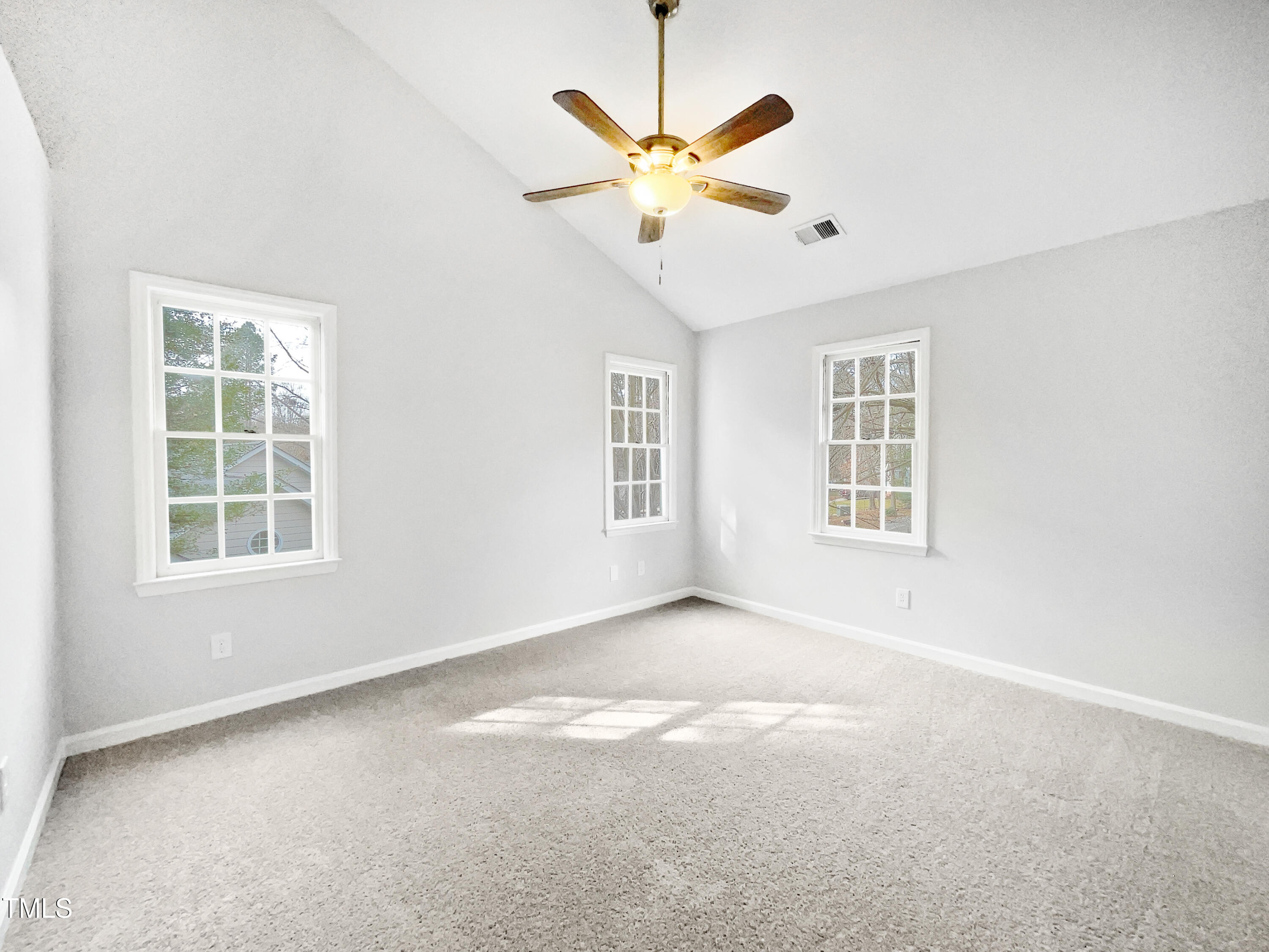 3604 Tunas Street Raleigh, NC 27616 - Photo 15 of 21 an empty room with windows and fan
