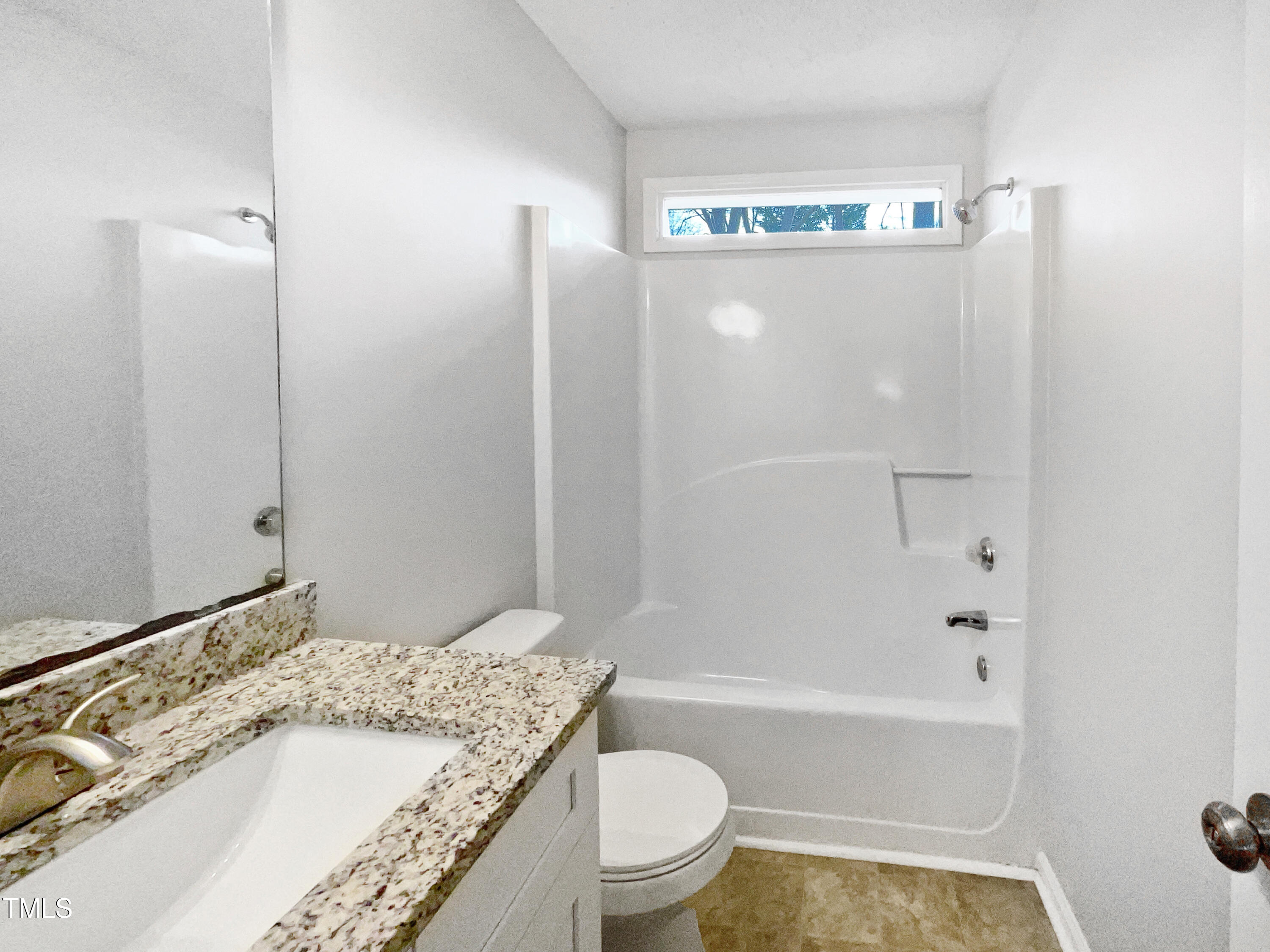3604 Tunas Street Raleigh, NC 27616 - Photo 18 of 21 a bathroom with a granite countertop sink a toilet and shower