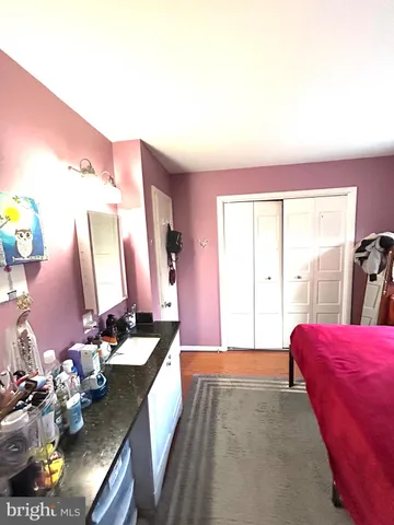 a bedroom with furniture and a bed