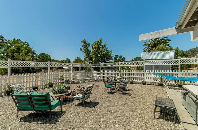 a view of a lake with outdoor seating
