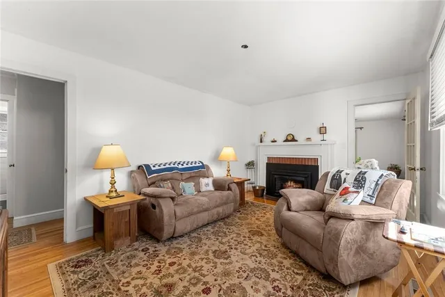 a living room with furniture and a lamp