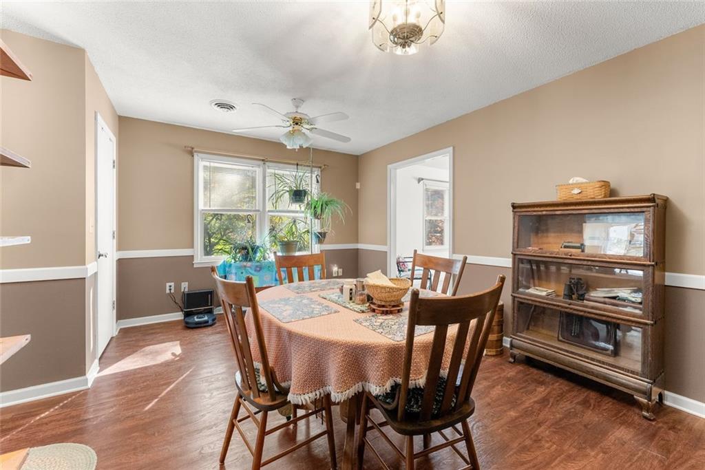 3089 Highway 17 Alternate Toccoa, GA 30577 - Photo 20 of 51 a dining room with furniture a rug and wooden floor