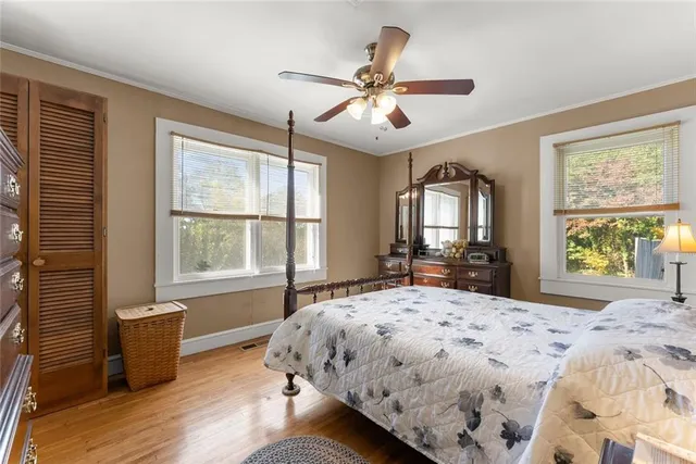 a bedroom with a large bed and a window