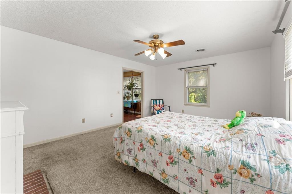 3089 Highway 17 Alternate Toccoa, GA 30577 - Photo 25 of 51 a bedroom with a bed and a window