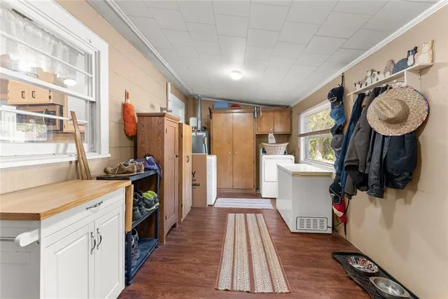 a kitchen with a refrigerator and a sink