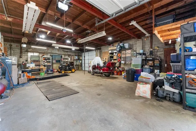 a view of parking garage with cars