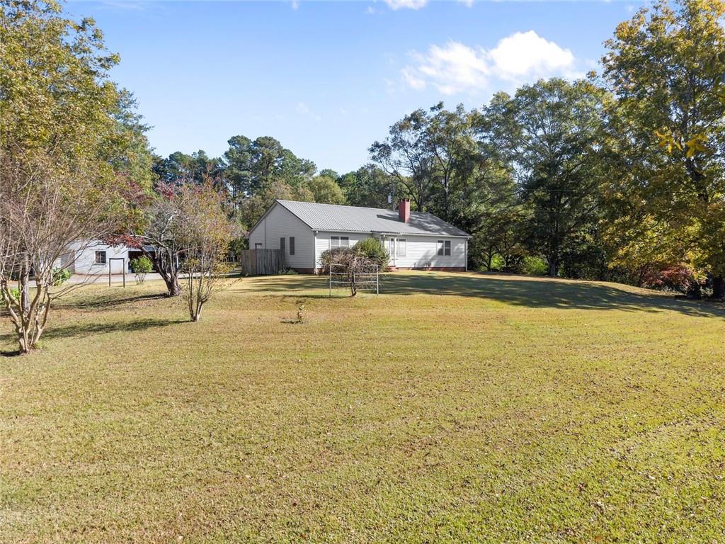 3089 Highway 17 Alternate Toccoa, GA 30577 - Photo 9 of 51 a swimming pool with trees in front of it