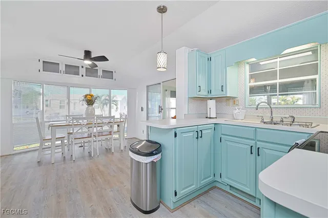 a kitchen with sink cabinets and window