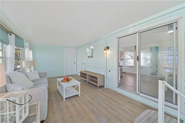 a bedroom with furniture and a wooden floor