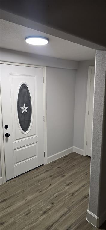 405 Southwest 6th Street Grand Prairie, TX 75051 - Photo 3 of 16 Foyer with dark wood-style flooring and baseboards