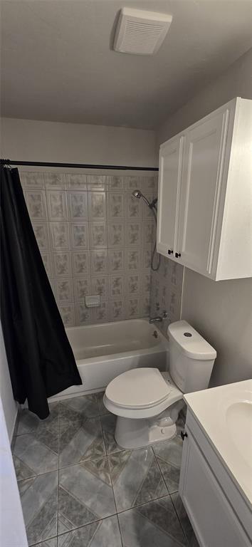 405 Southwest 6th Street Grand Prairie, TX 75051 - Photo 7 of 16 Bathroom with shower / bath combo, vanity, and tile patterned flooring