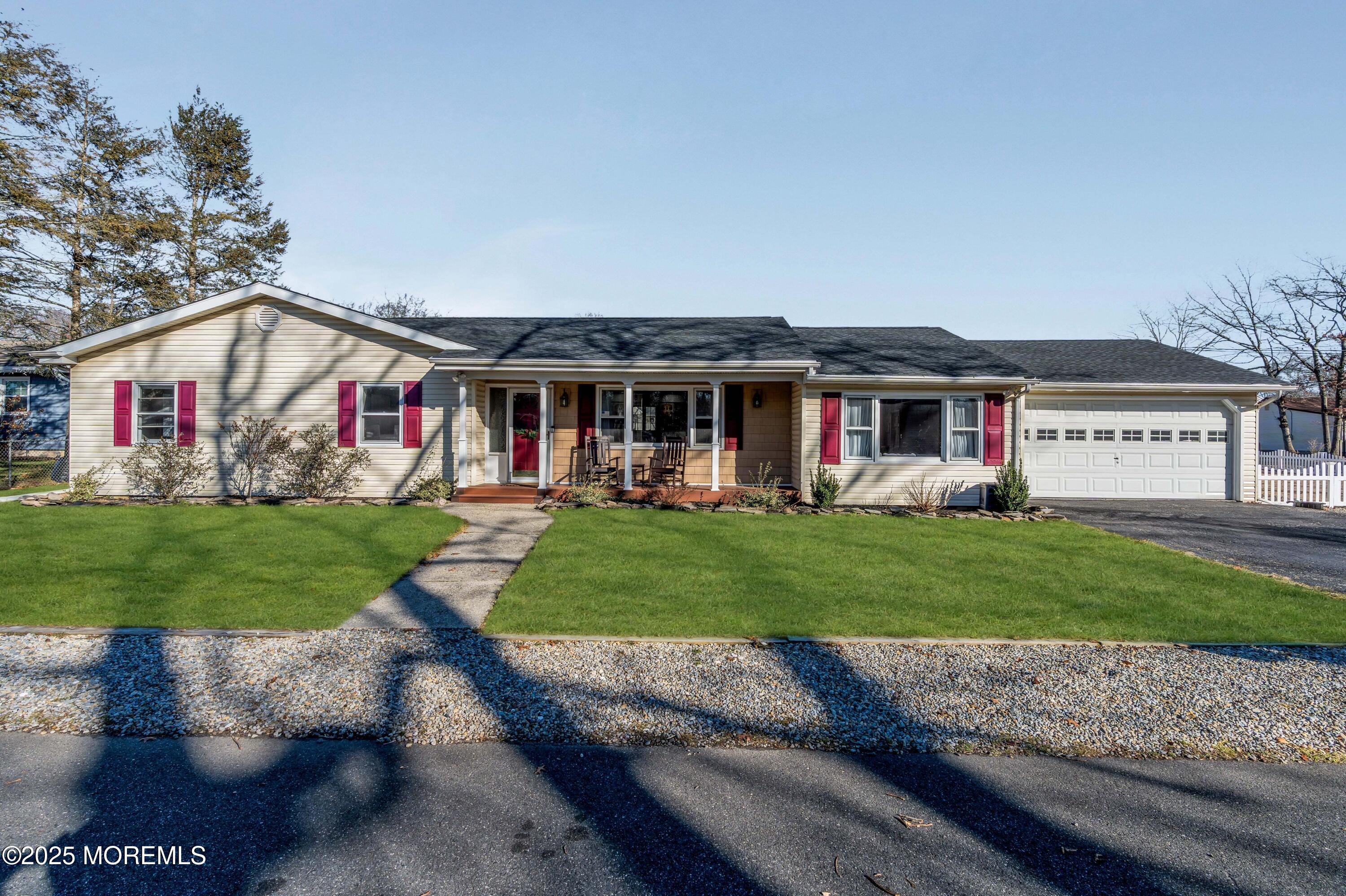 a front view of a house with a yard table and chairs