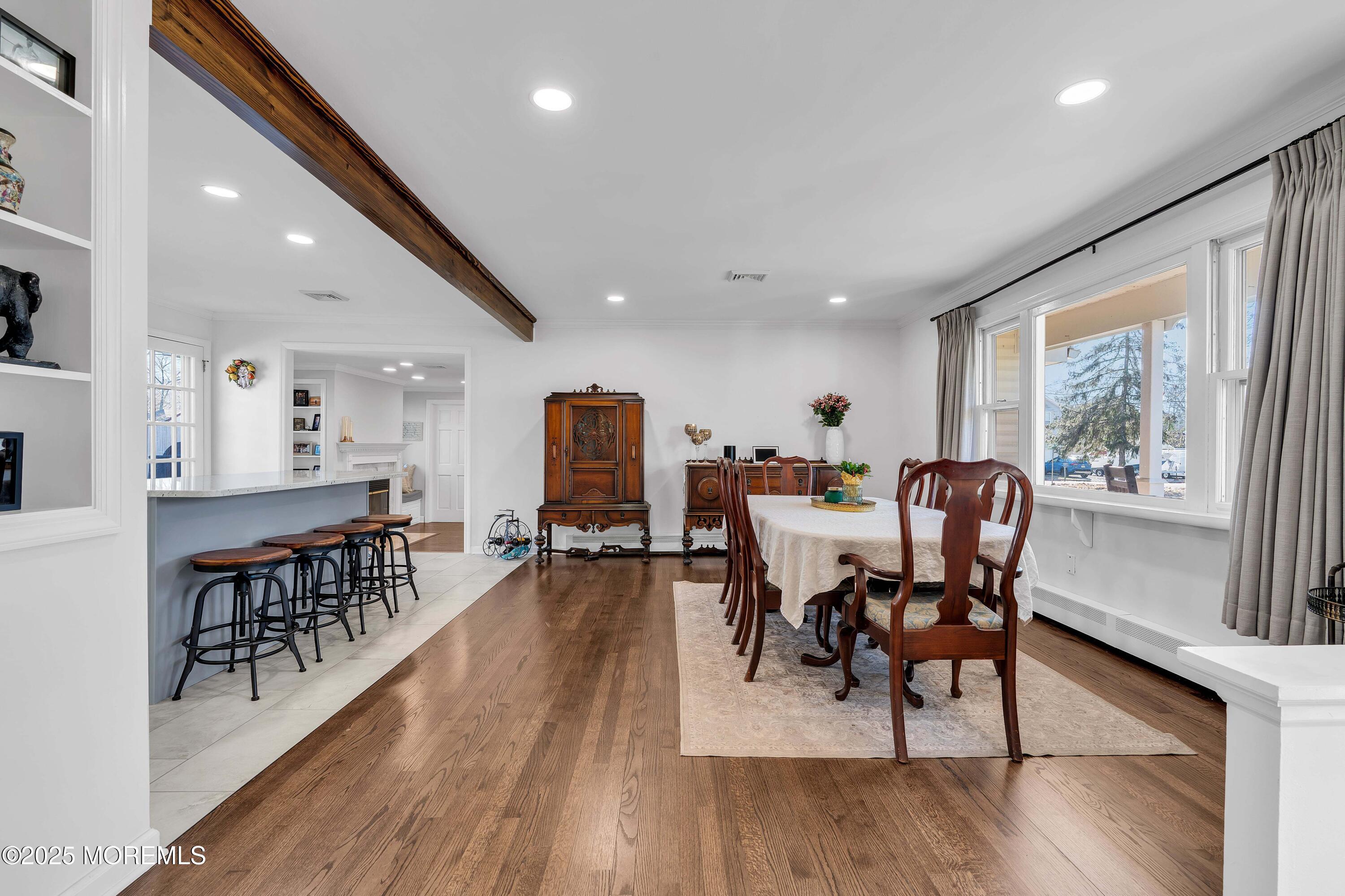 520 Windsor Street Forked River, NJ 08731 - Photo 11 of 36 a dining room with furniture a rug and wooden floor