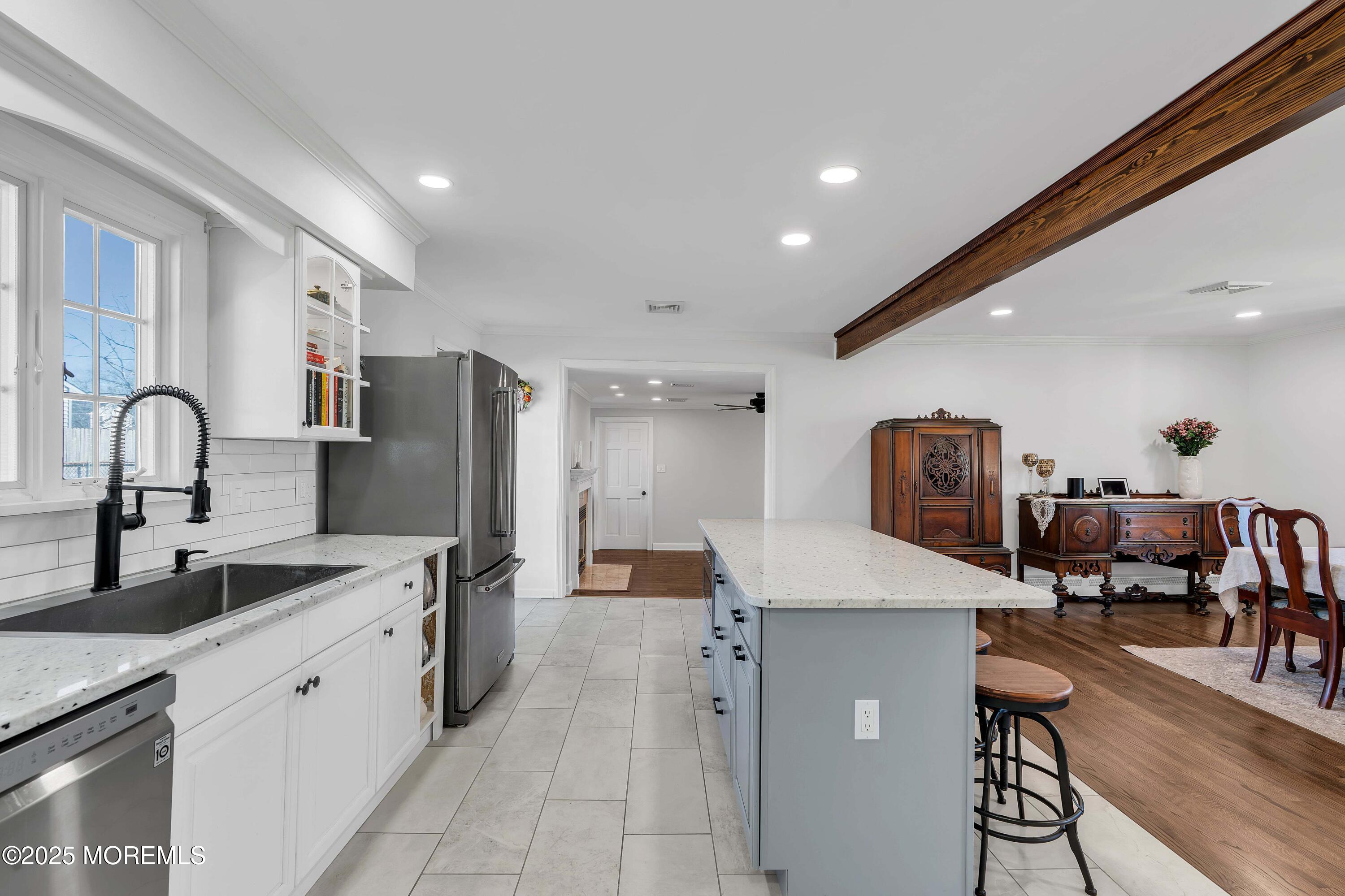 520 Windsor Street Forked River, NJ 08731 - Photo 16 of 36 a large kitchen with stainless steel appliances lots of counter space and windows