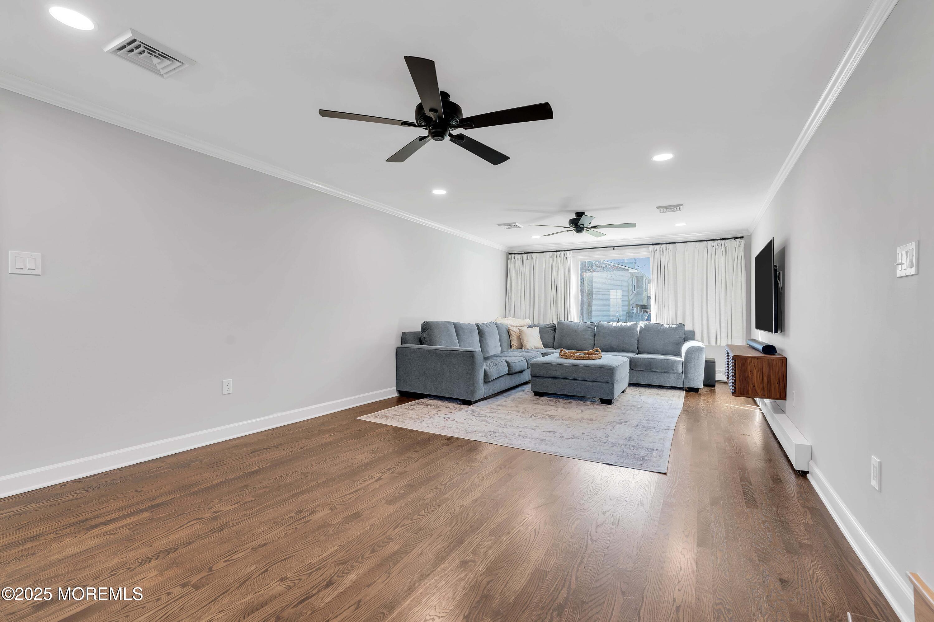 520 Windsor Street Forked River, NJ 08731 - Photo 17 of 36 a living room with furniture and a ceiling fan