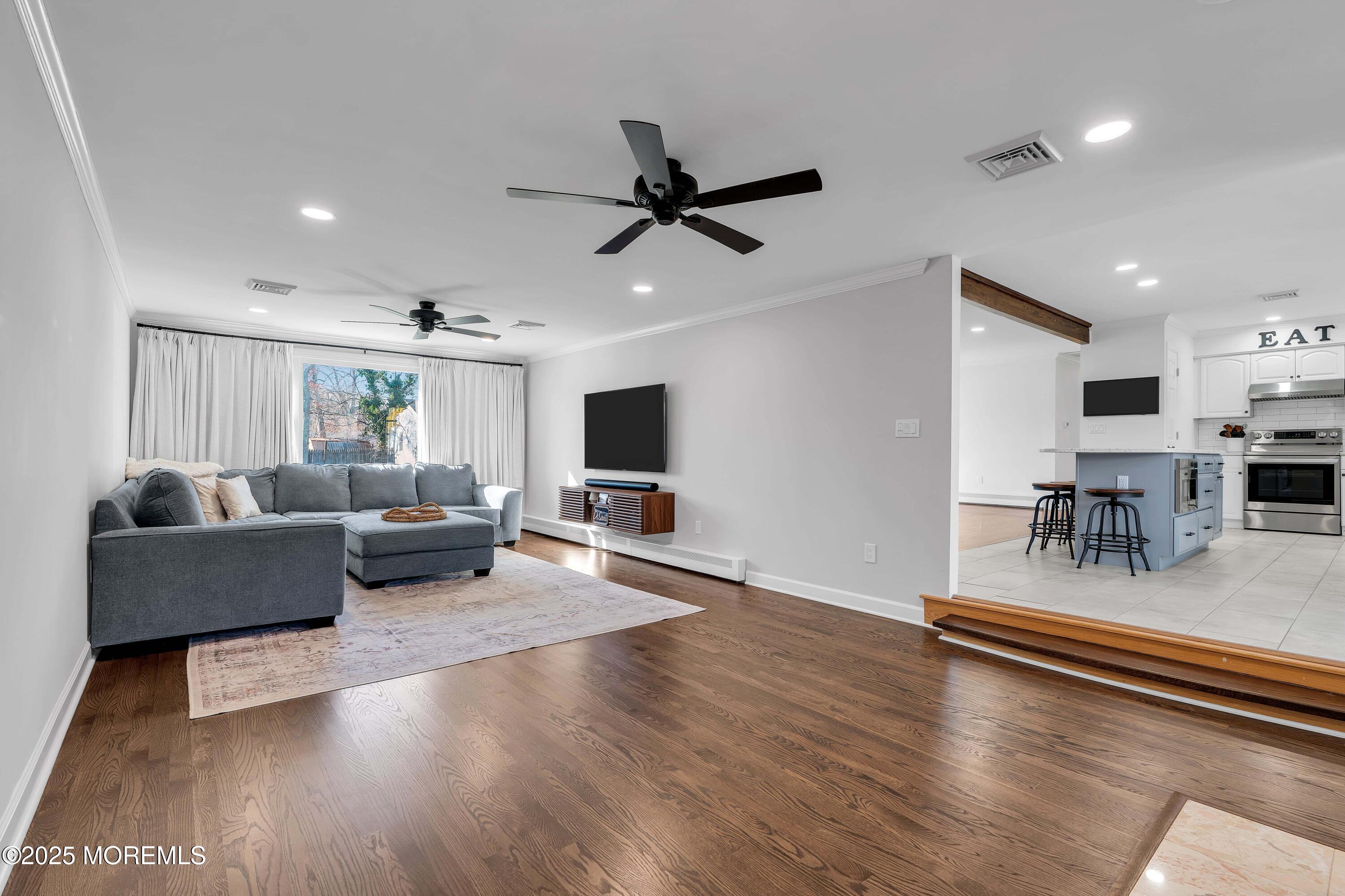 520 Windsor Street Forked River, NJ 08731 - Photo 18 of 36 a living room with furniture and a flat screen tv
