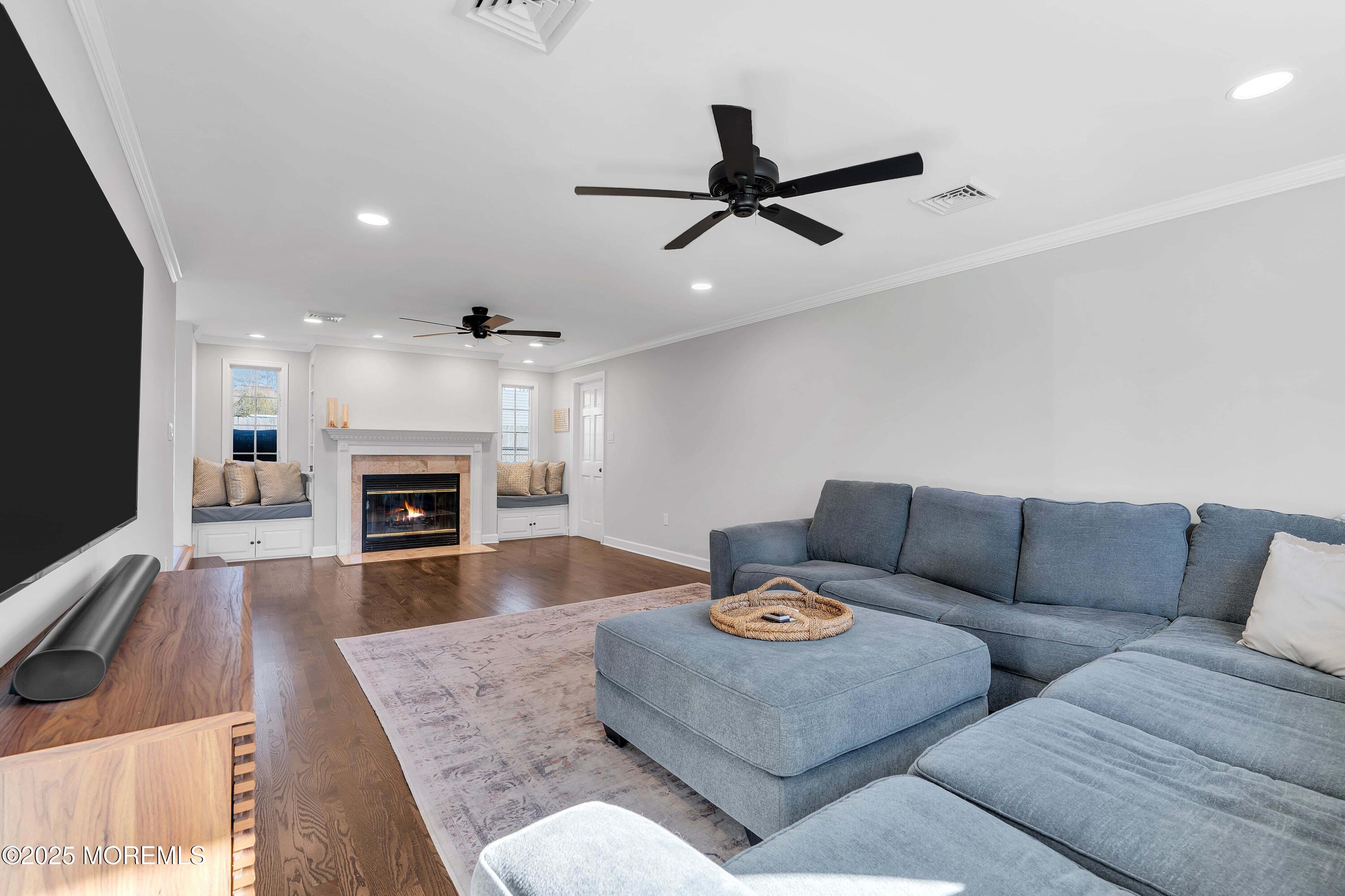 520 Windsor Street Forked River, NJ 08731 - Photo 19 of 36 a living room with furniture and a fireplace