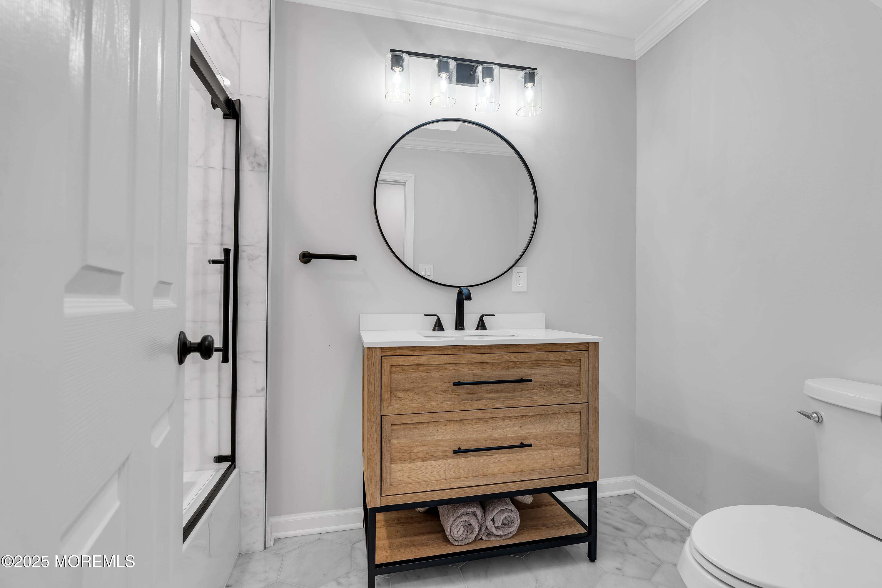 520 Windsor Street Forked River, NJ 08731 - Photo 23 of 36 a bathroom with a toilet a sink and a mirror