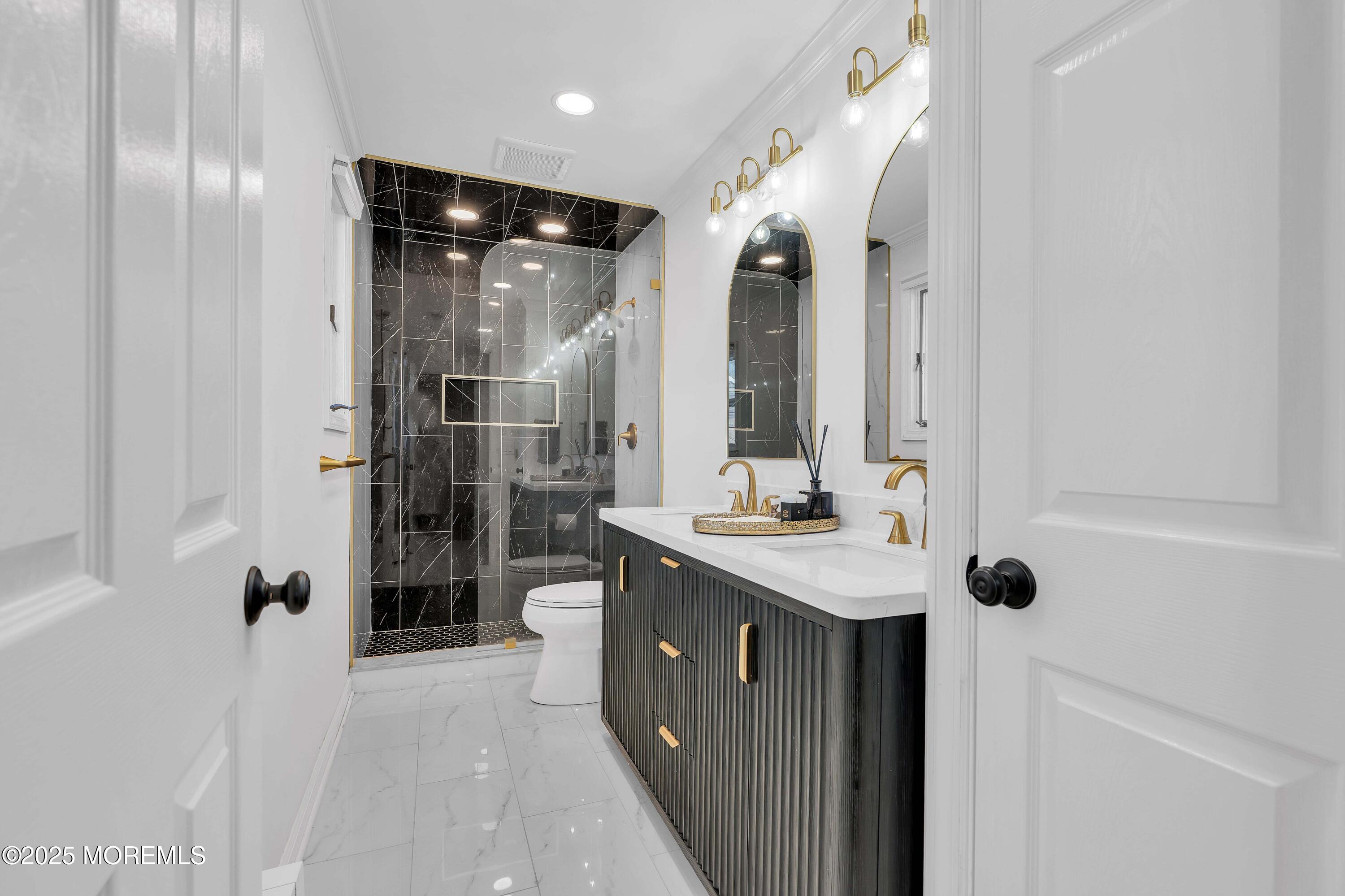 520 Windsor Street Forked River, NJ 08731 - Photo 27 of 36 a bathroom with a shower sink and mirror