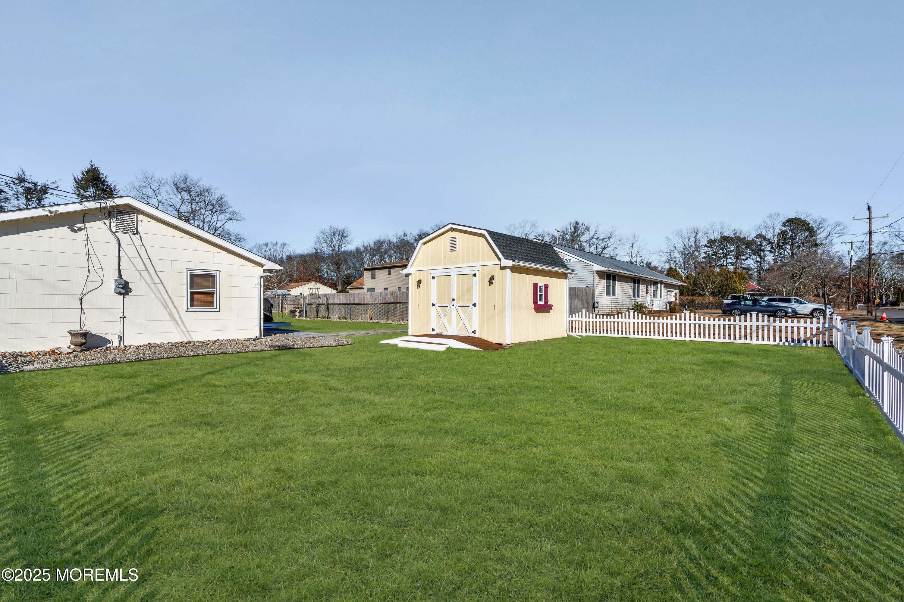 520 Windsor Street Forked River, NJ 08731 - Photo 30 of 36 a view of a house with a yard