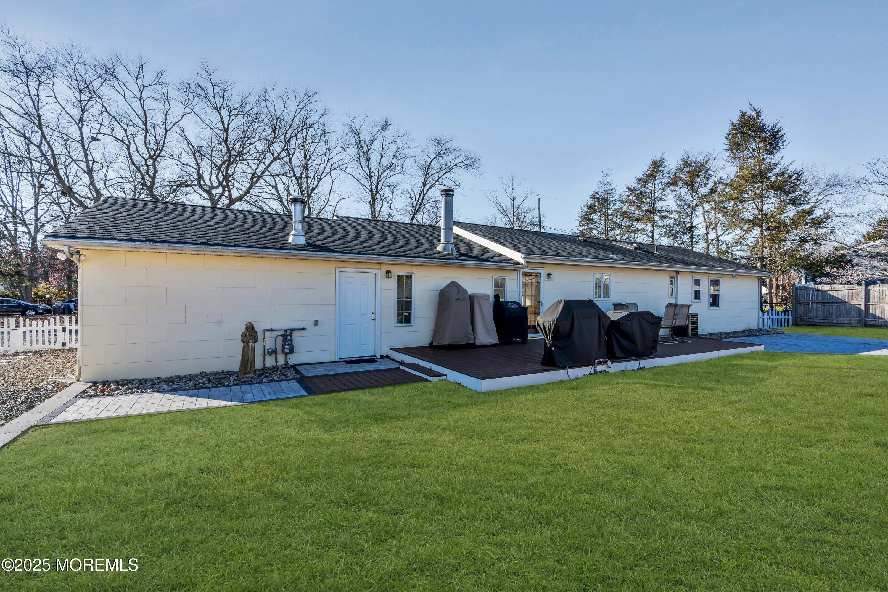520 Windsor Street Forked River, NJ 08731 - Photo 32 of 36 a front view of a house with a yard and trees