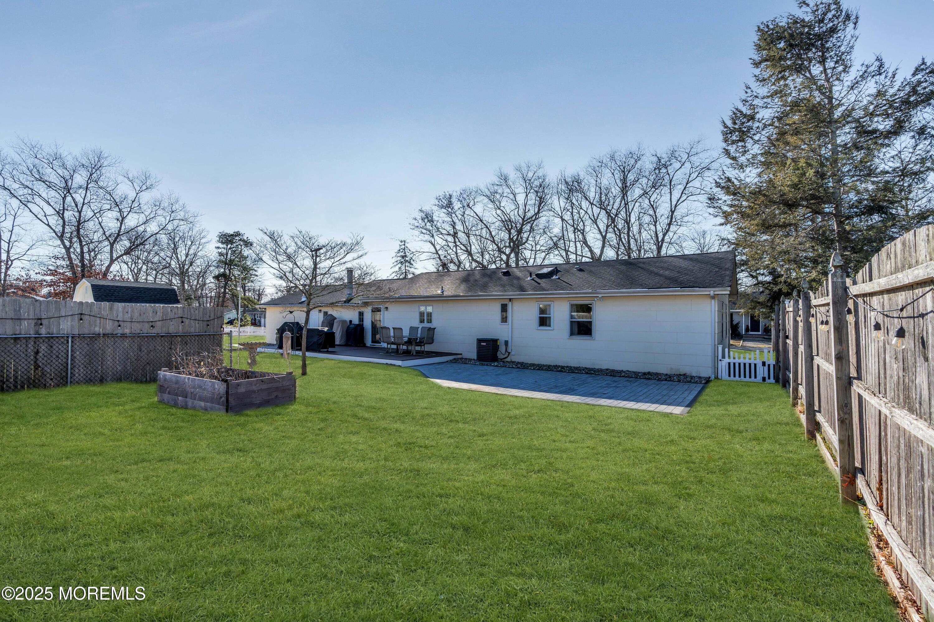 520 Windsor Street Forked River, NJ 08731 - Photo 34 of 36 a view of a house with backyard and a slide