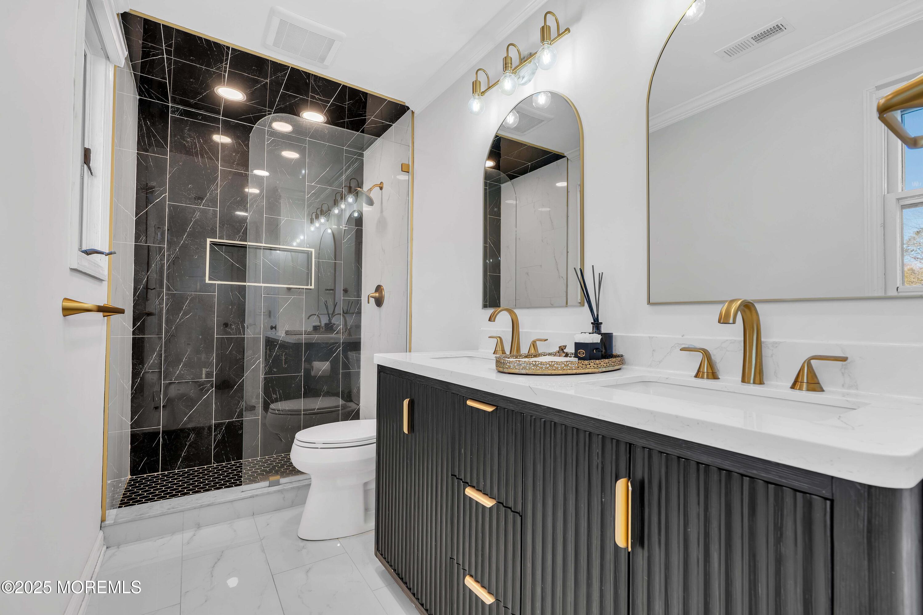 520 Windsor Street Forked River, NJ 08731 - Photo 6 of 36 a bathroom with a double vanity sink toilet and shower