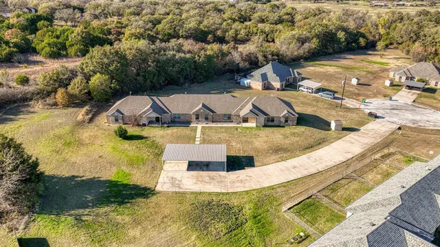 a view of a swimming pool with a yard