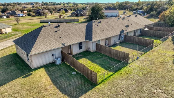 an aerial view of a house having swimming pool