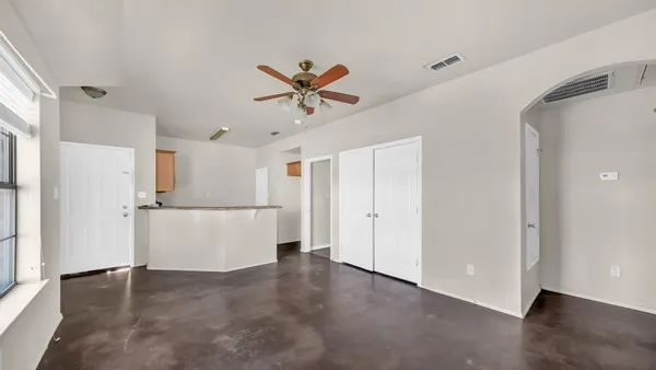 a view of a kitchen with a sink and a refrigerator