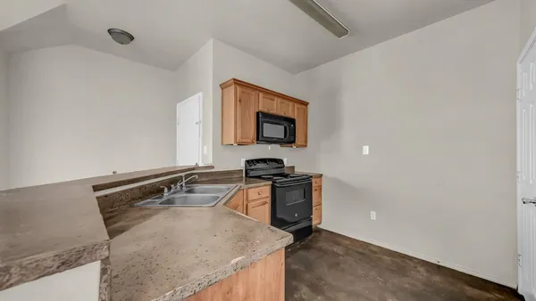 a kitchen with a stove and a sink