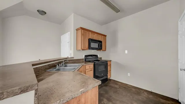 a kitchen with a stove and a sink