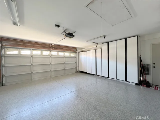 a view of an empty room with a windows